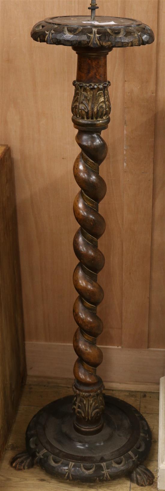 A Continental walnut barley twist torchere W.38cm